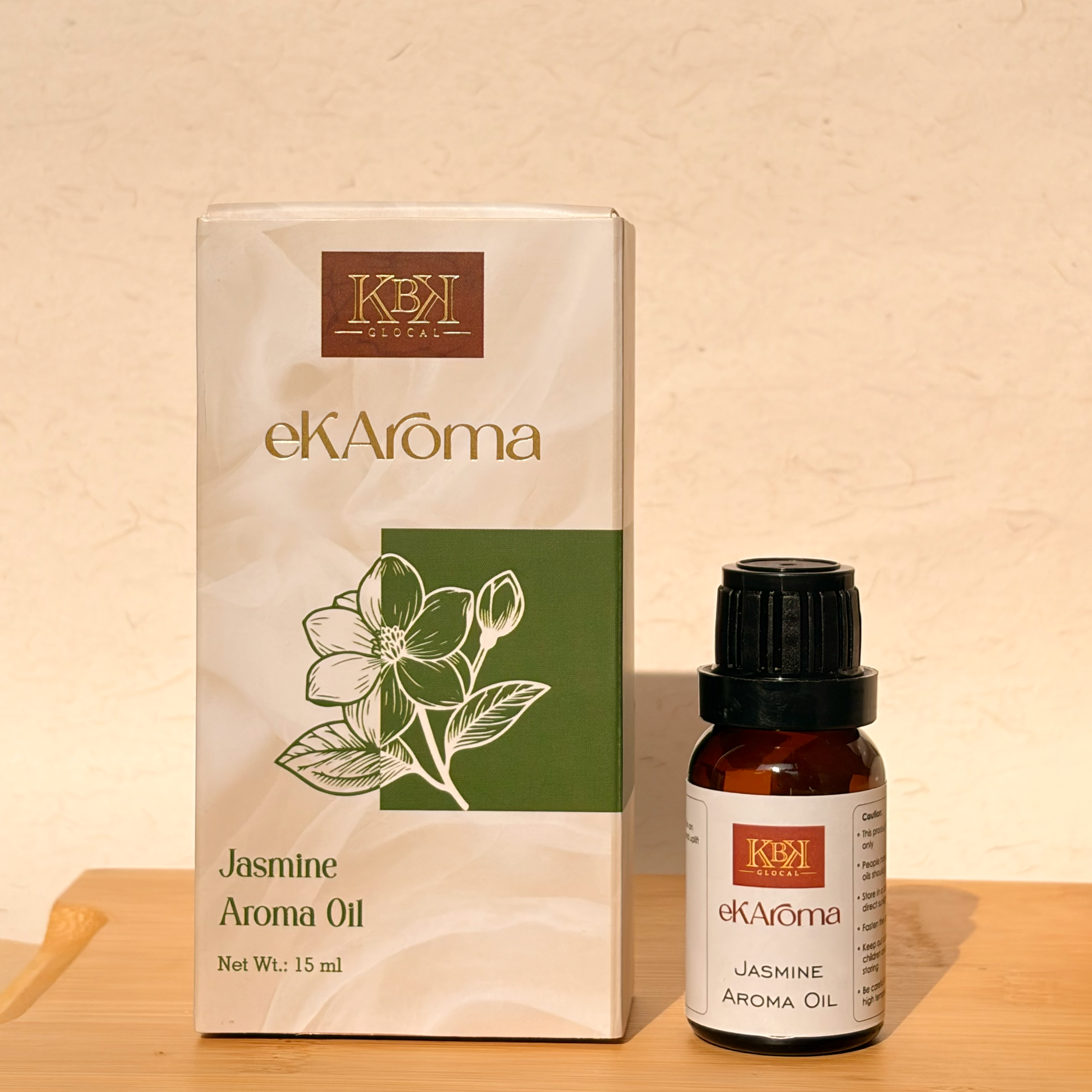 eKARoma Jasmine Aroma Oil packaging and bottle on a wooden surface with a beige background