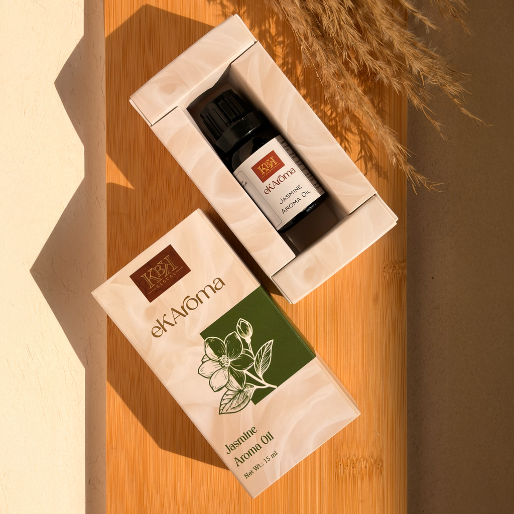 ekAroma Jasmine Aroma Oil bottle and packaging on a wooden surface with dried plants.